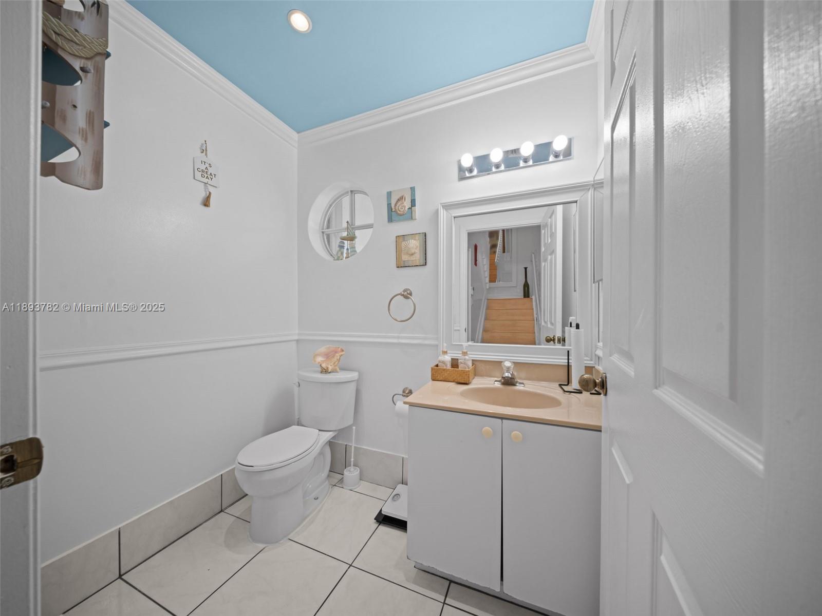 7486 Southwest 162nd Court Miami, FL 33193 - Photo 10 of 47 a bathroom with a sink toilet and mirror