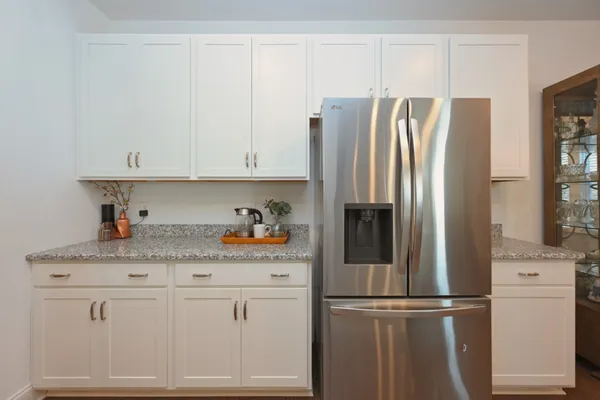 a kitchen with appliances and cabinets