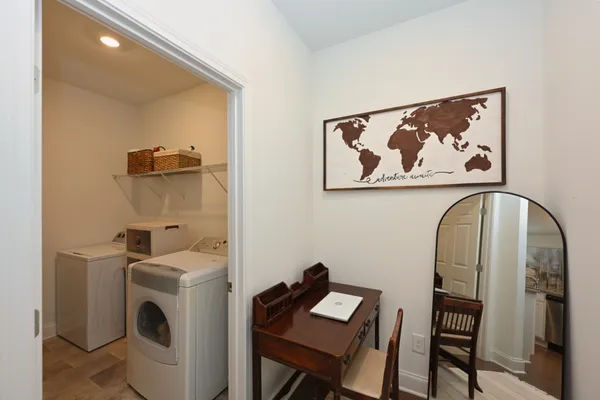 a view of storage and utility room with washer and dryer