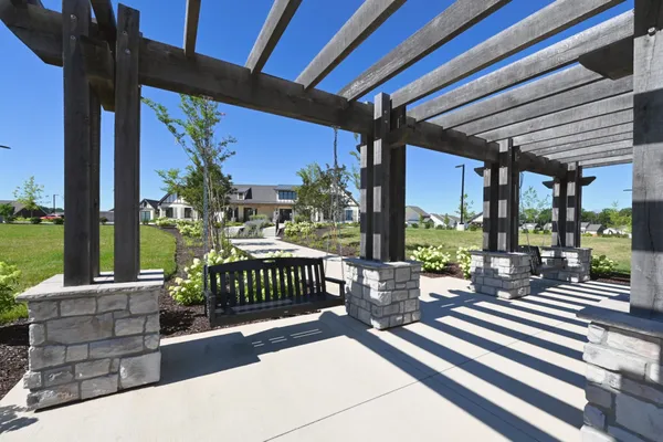 a view of a patio with a table chairs and a porch