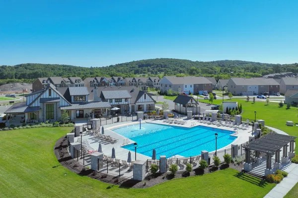 a view of a house with swimming pool yard and outdoor seating