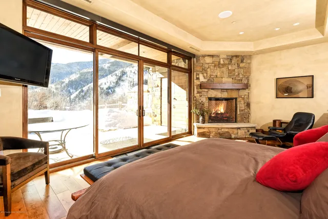 a bed room with a bed and a television