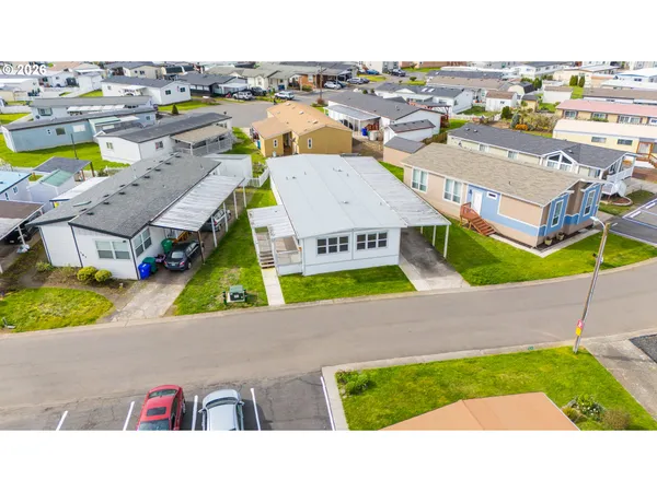 a aerial view of a house with a swimming pool