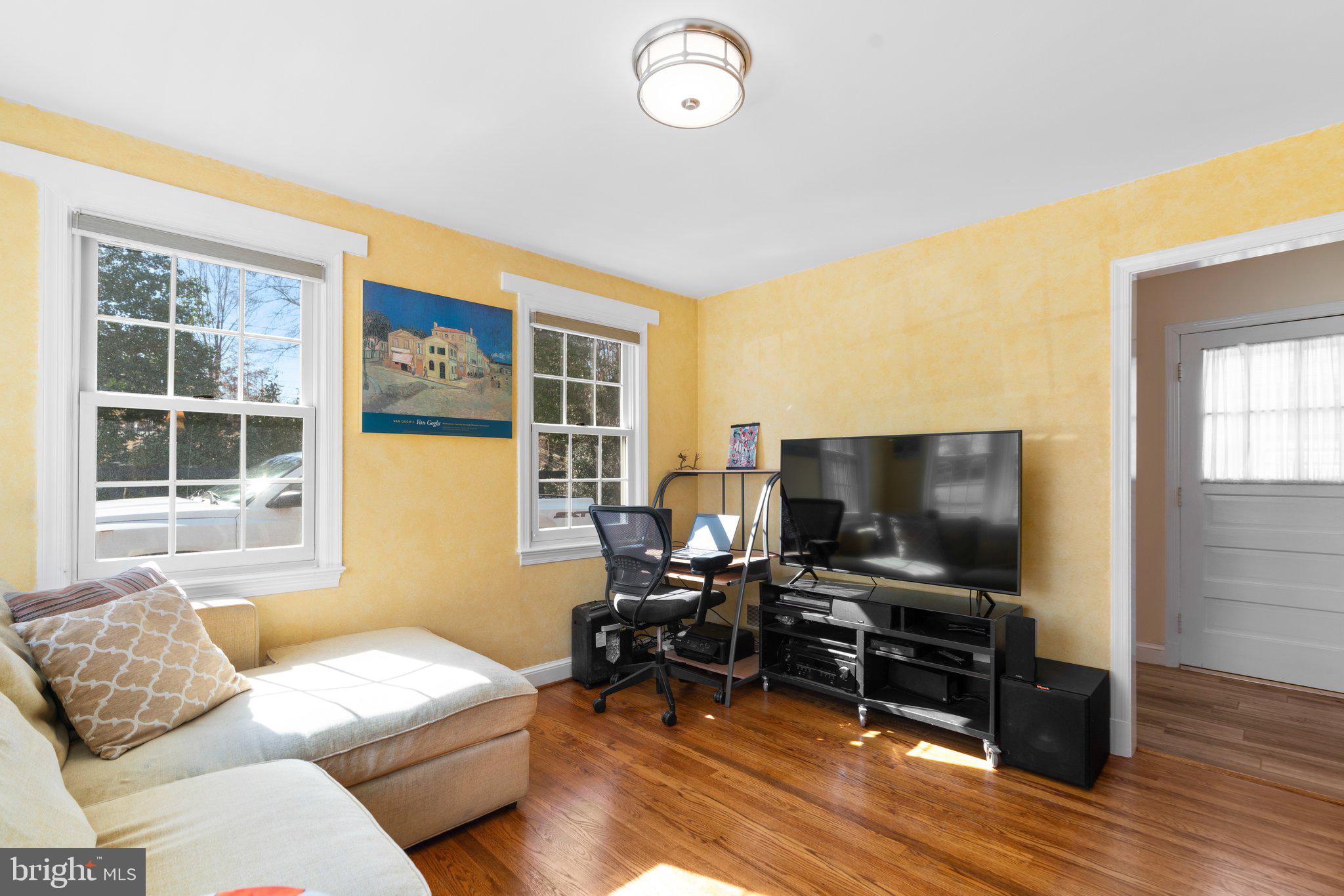 1616 Overlook Drive Silver Spring, MD 20903 - Photo 22 of 69 a living room with furniture and a flat screen tv