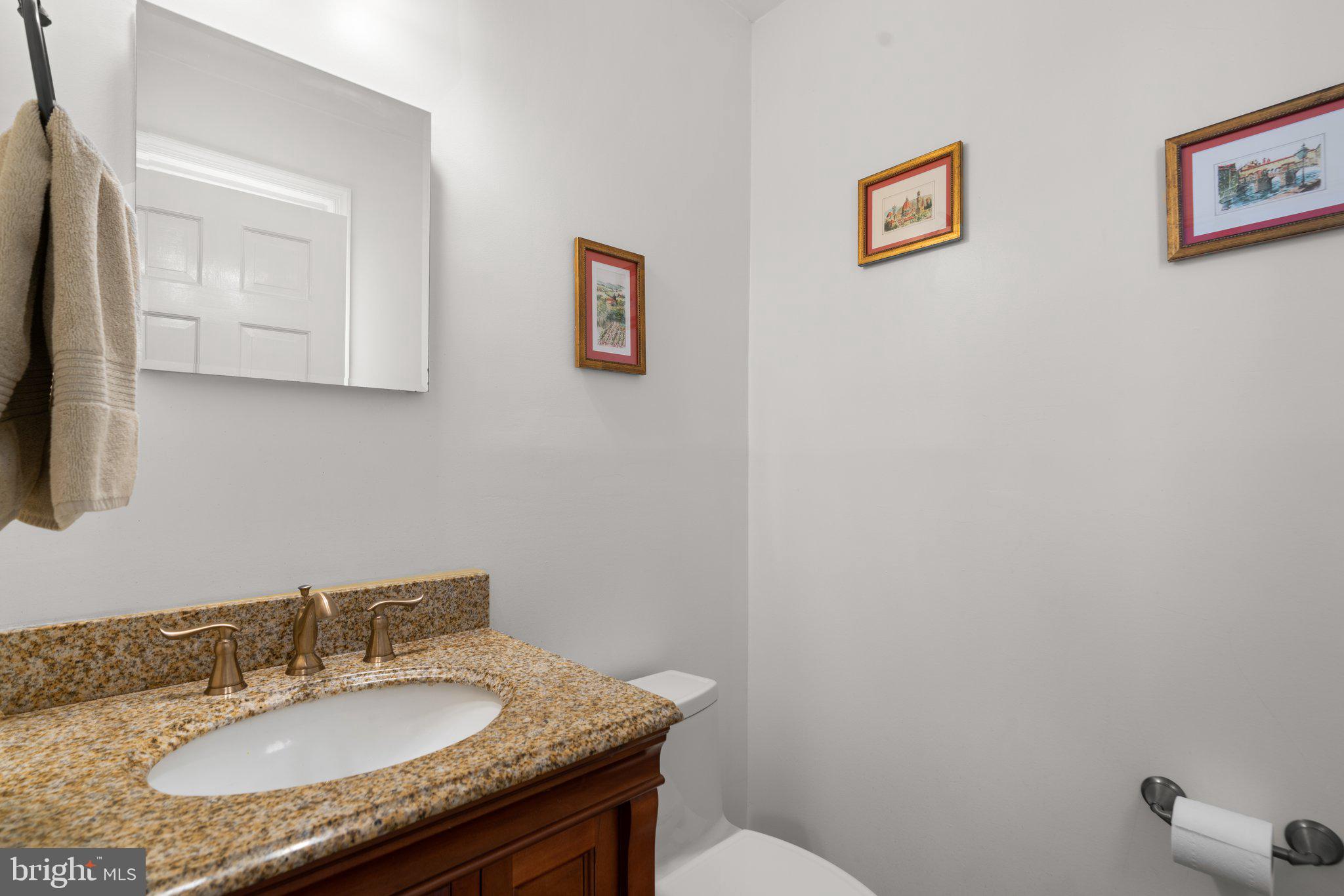 1616 Overlook Drive Silver Spring, MD 20903 - Photo 24 of 69 a bathroom with a granite countertop sink a mirror and a toilet