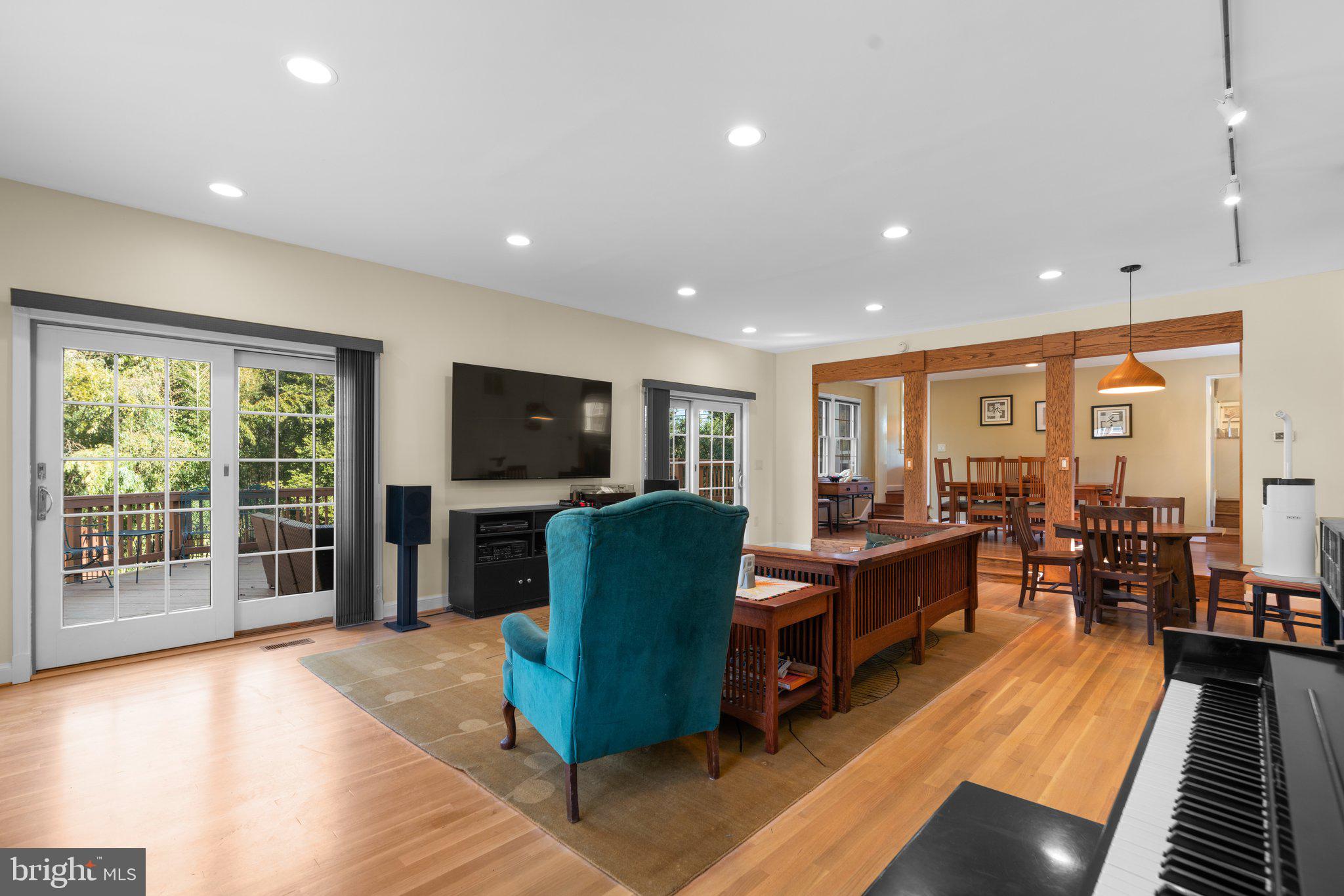 1616 Overlook Drive Silver Spring, MD 20903 - Photo 27 of 69 a living room with furniture flat screen tv and a large window