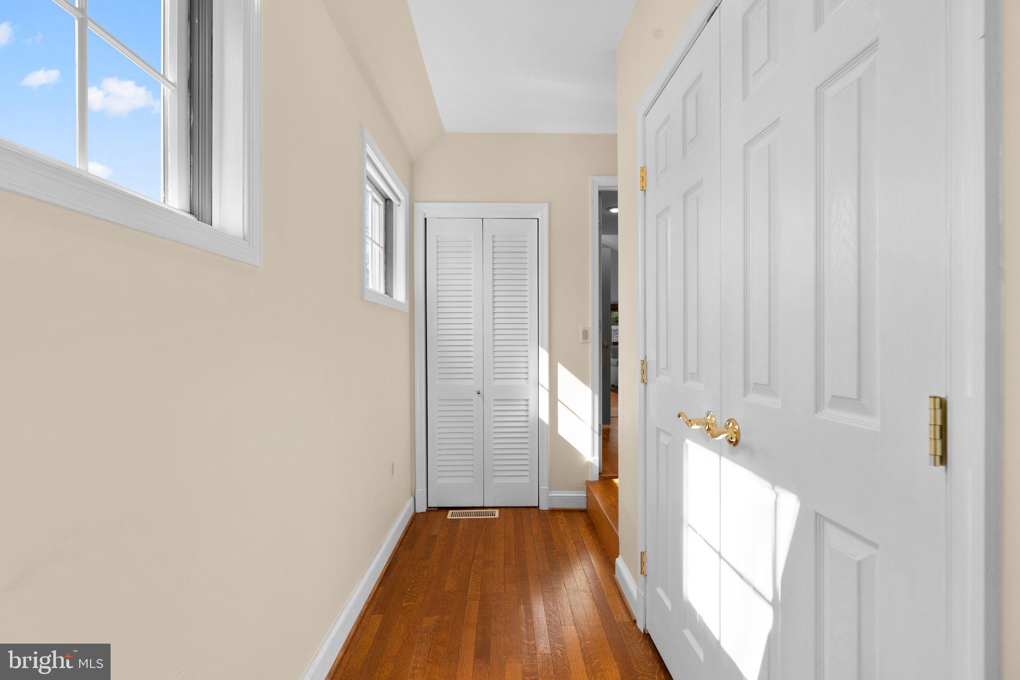 1616 Overlook Drive Silver Spring, MD 20903 - Photo 36 of 69 a view of a hallway with wooden floor and staircase