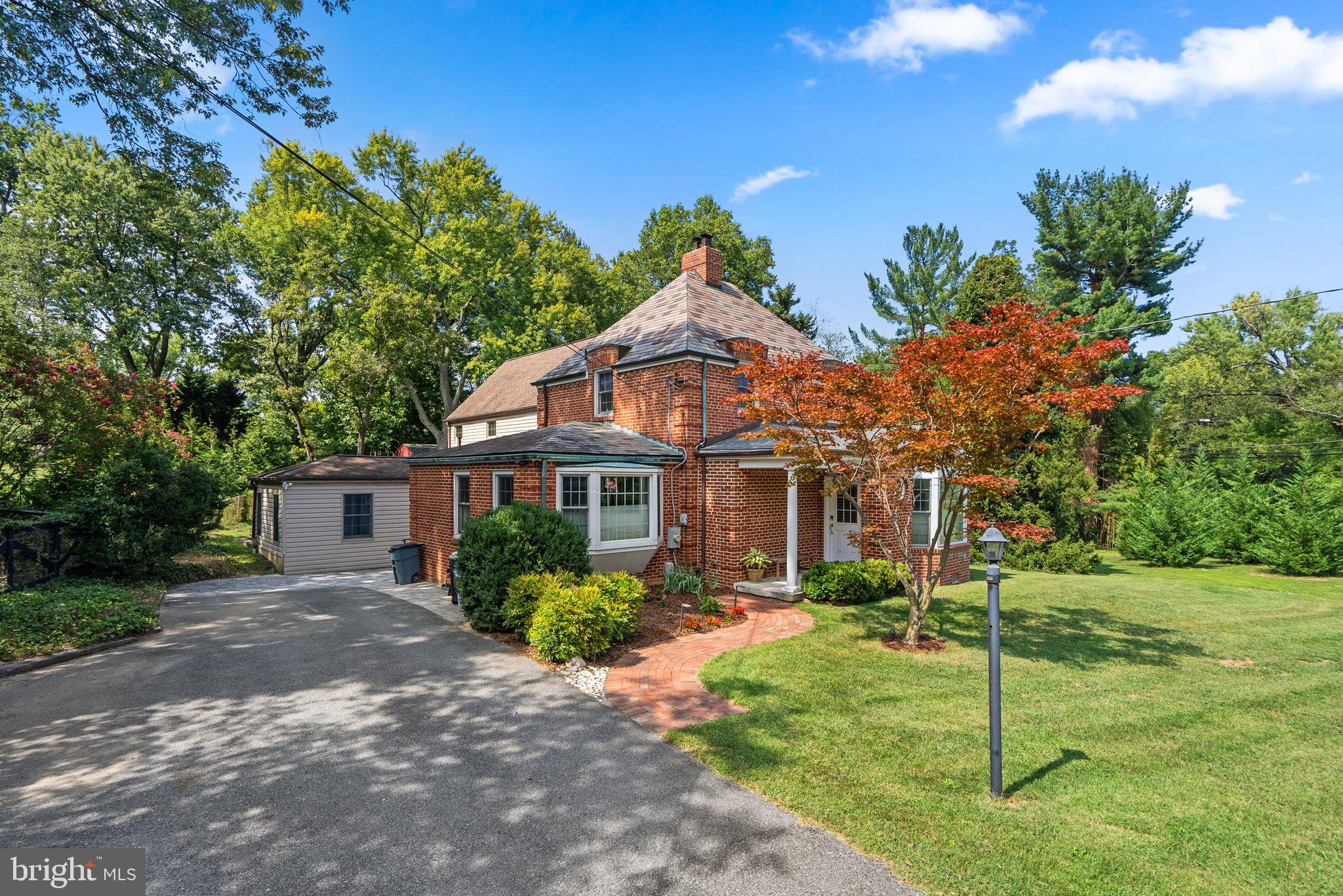 1616 Overlook Drive Silver Spring, MD 20903 - Photo 4 of 69 a front view of a house with a garden