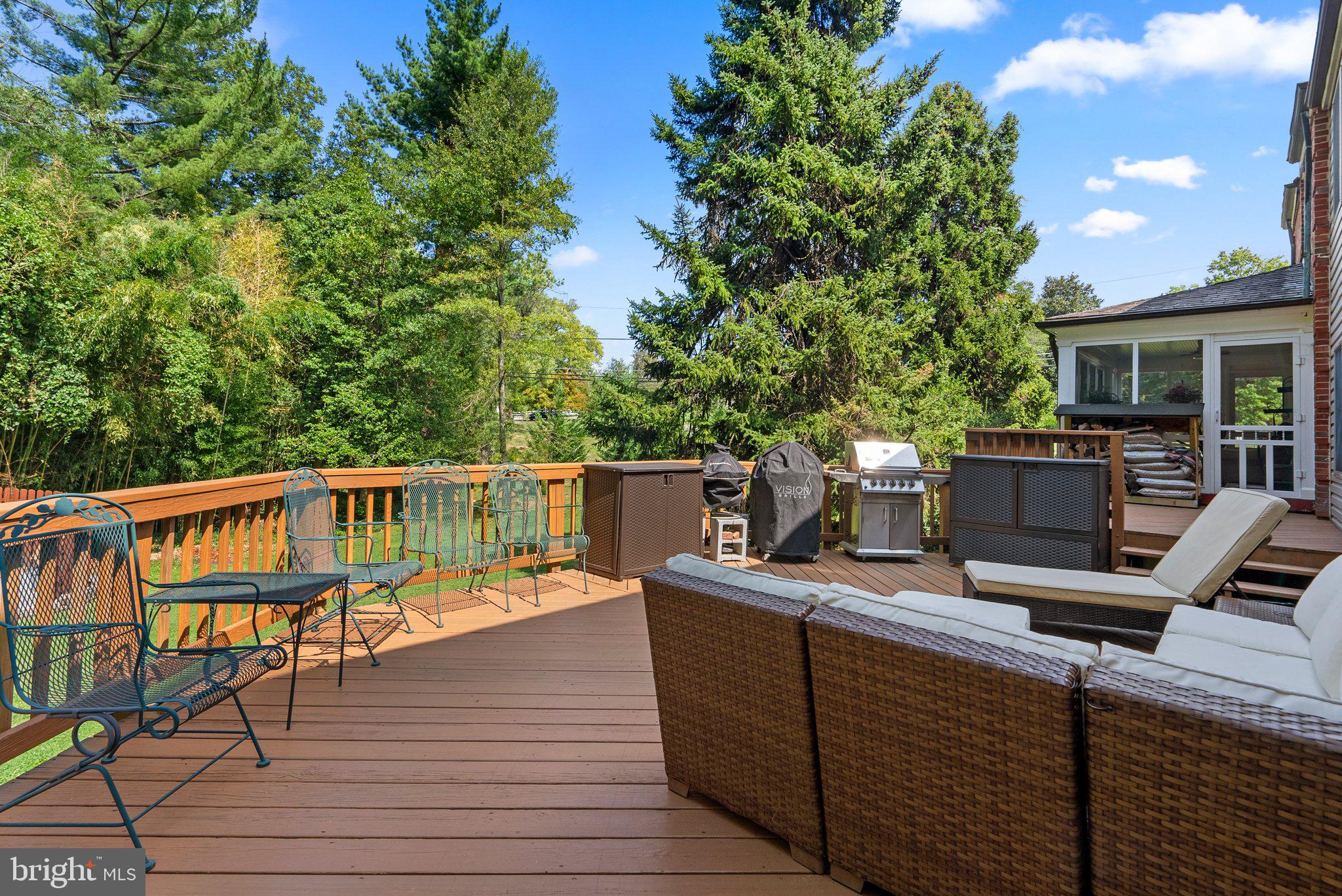 1616 Overlook Drive Silver Spring, MD 20903 - Photo 57 of 69 a view of a deck with chairs a barbeque with wooden floor and fence