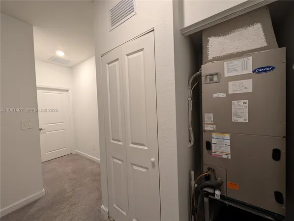 a view of a hallway with closet