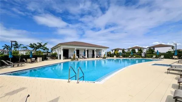a view of a swimming pool with a patio