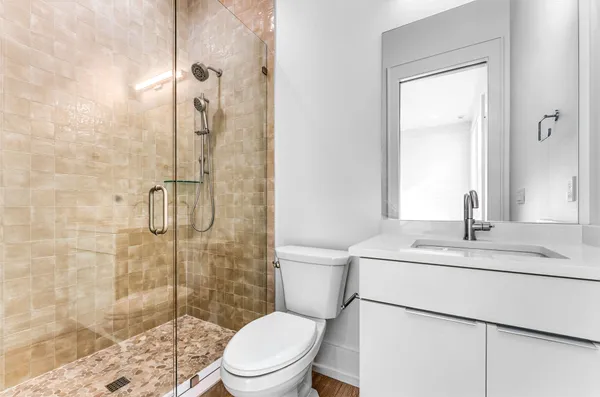 a bathroom with a double vanity sink and a mirror