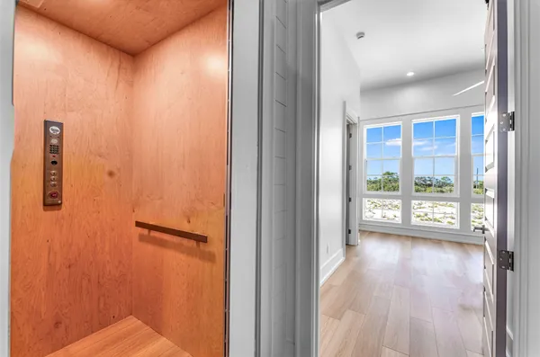 a view of storage and utility room with windows