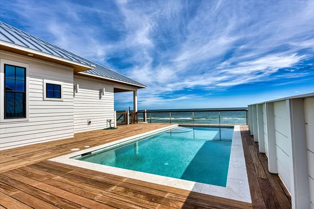 a view of swimming pool with seating area