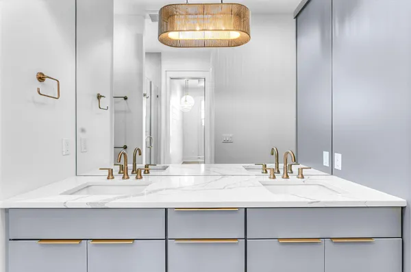 a bedroom with two beds and painting on the wall