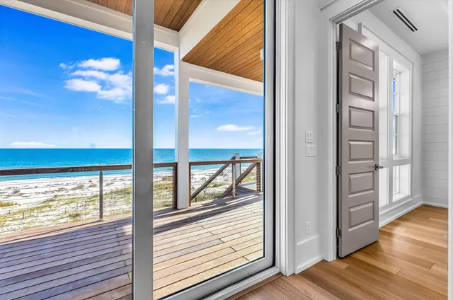 a view of an empty room and a window