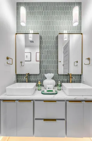 a white bath tub sitting next to a white wall