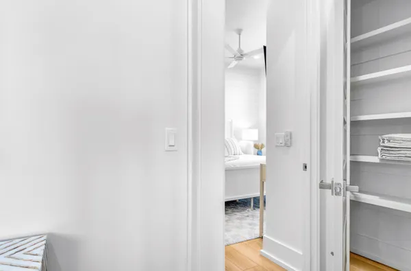 a view of a balcony with floor to ceiling windows with wooden floor