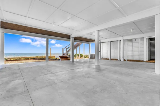 a view of a livingroom with furniture and an entryway