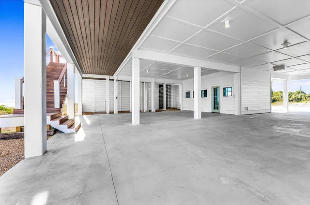 a view of a house with a wooden floor and a dining table