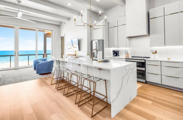 a kitchen with a sink and a large window