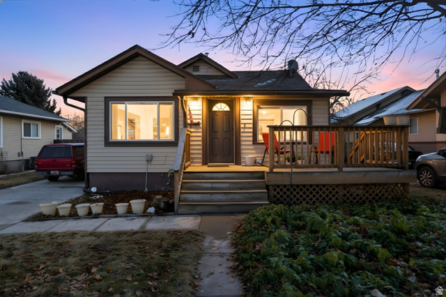 Bungalow-style home featuring a wooden deck