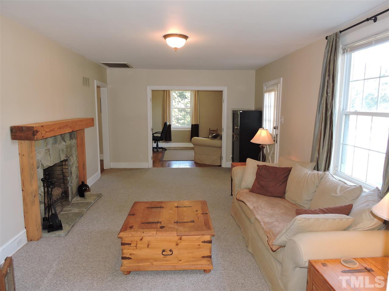 10819 North Roxboro Road Rougemont, NC 27572 - Photo 2 of 19 a living room with furniture and a fireplace