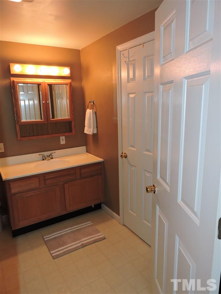10819 North Roxboro Road Rougemont, NC 27572 - Photo 13 of 19 a bathroom with a bathtub sink and mirror