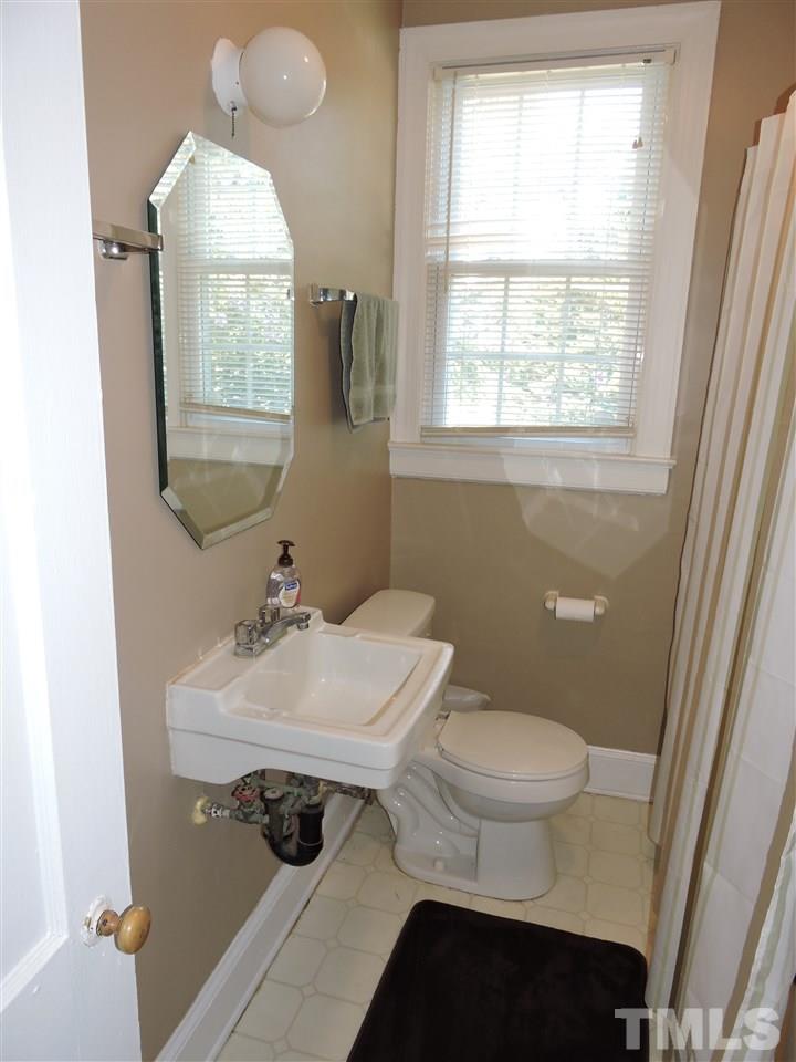 10819 North Roxboro Road Rougemont, NC 27572 - Photo 15 of 19 a bathroom with a sink toilet and window