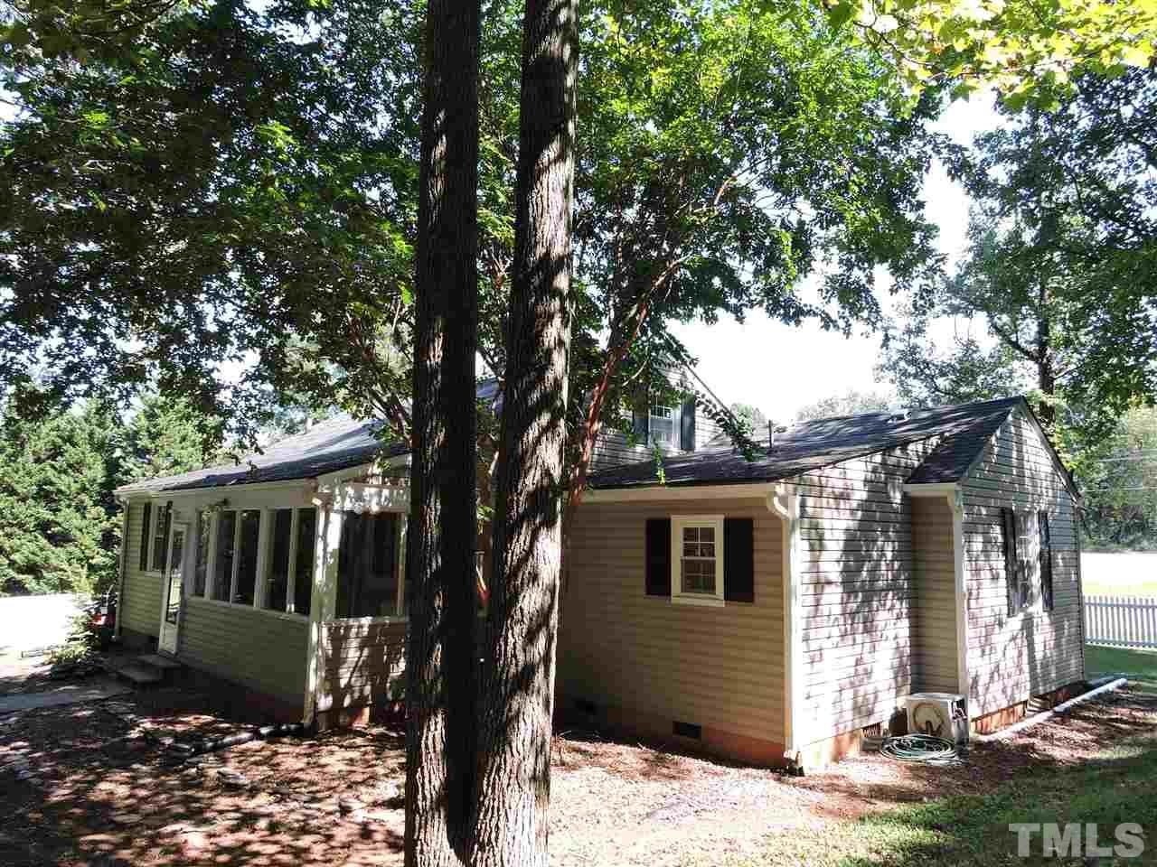 10819 North Roxboro Road Rougemont, NC 27572 - Photo 16 of 19 a front view of a house with garden