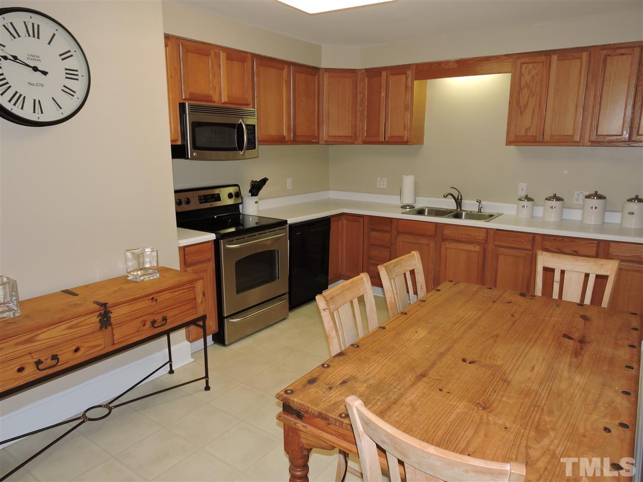 10819 North Roxboro Road Rougemont, NC 27572 - Photo 3 of 19 a kitchen with stainless steel appliances granite countertop a stove a sink and a microwave