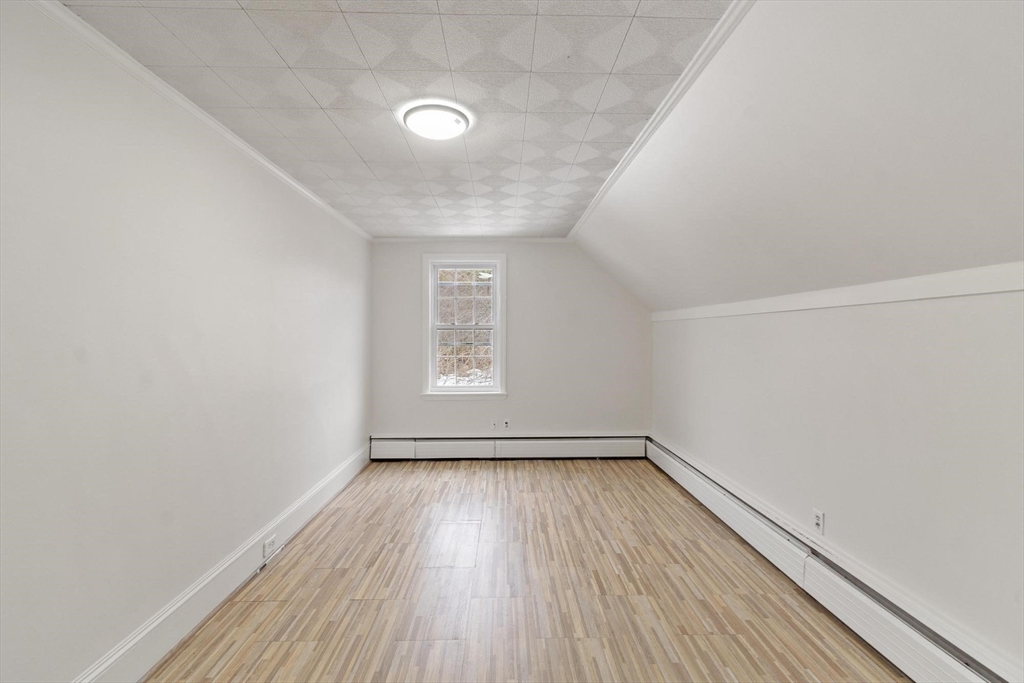 524 Merrimack Street Methuen, MA 01844 - Photo 21 of 42 a view of a room with wooden floor and window