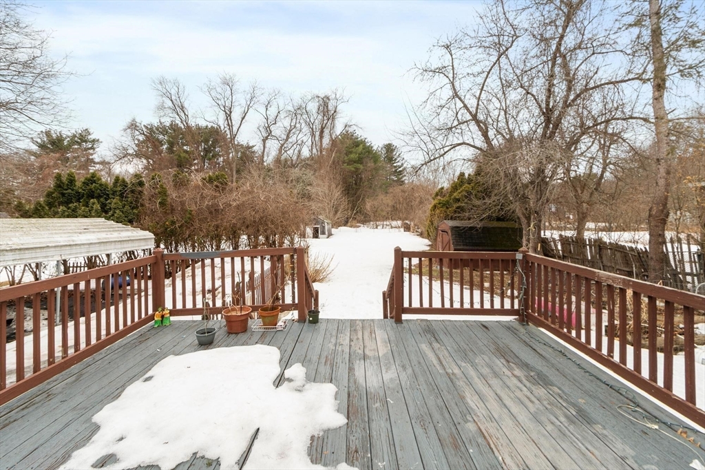 524 Merrimack Street Methuen, MA 01844 - Photo 29 of 42 a view of a balcony with wooden floor and fence