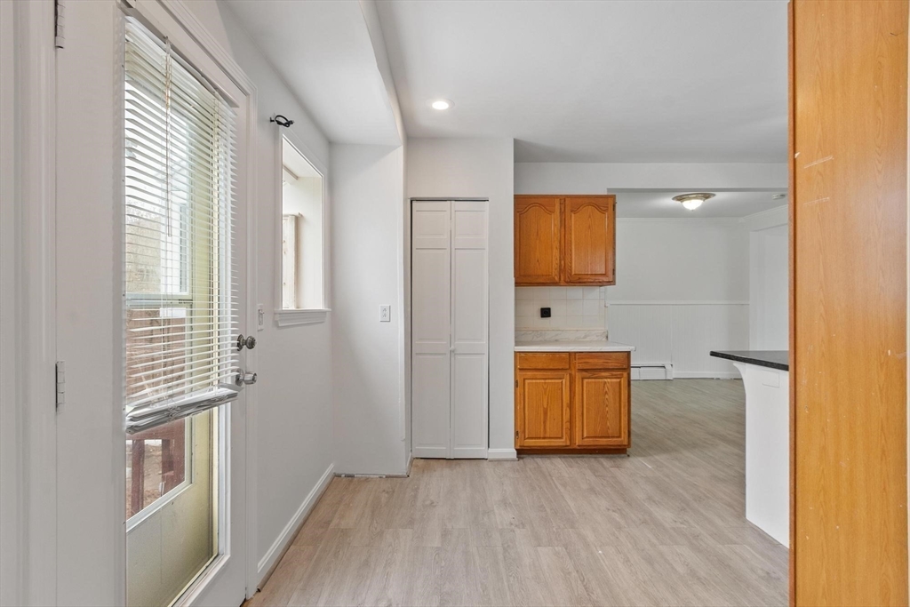 524 Merrimack Street Methuen, MA 01844 - Photo 9 of 42 a view of a room with wooden floor and cabinet