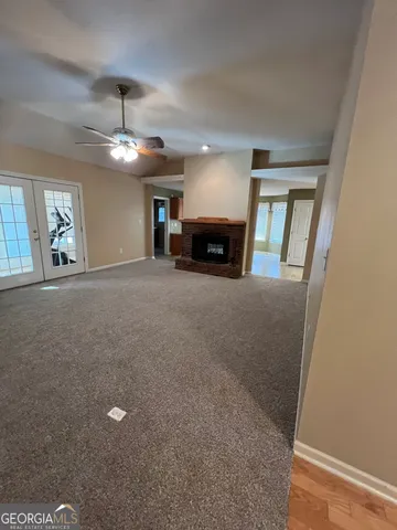 en view interior of a house with chandelier and fireplace