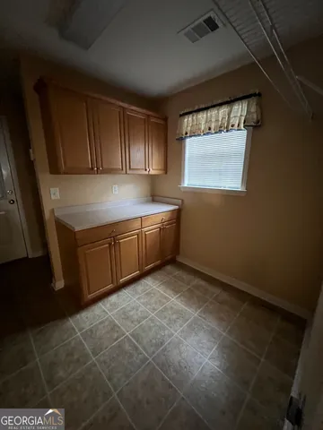 a kitchen with stainless steel appliances a sink stove and cabinets