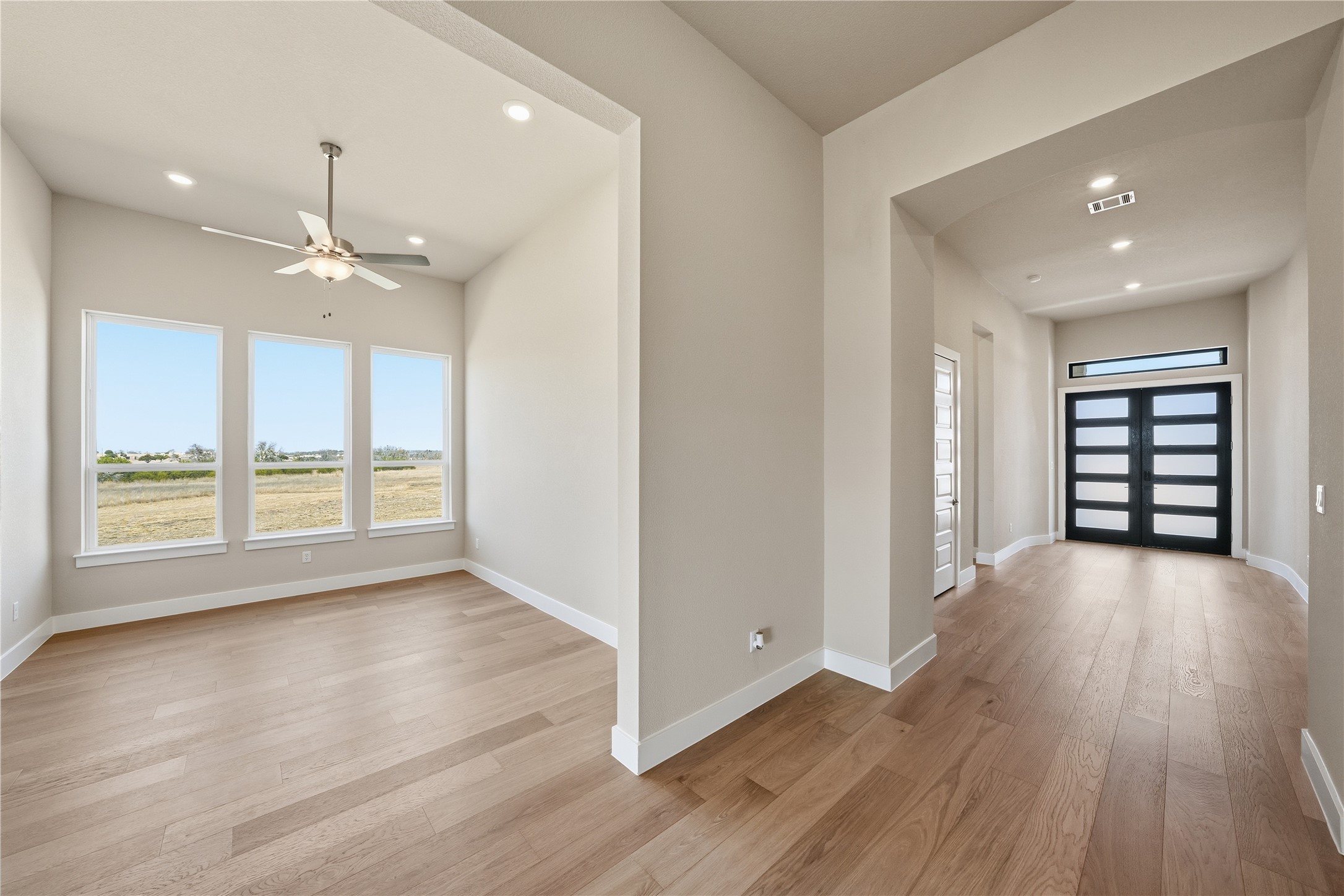 1209 Doelling Drive Georgetown, TX 78633 - Photo 9 of 31 Foyer featuring light wood-style flooring, recessed lighting, and ceiling fan