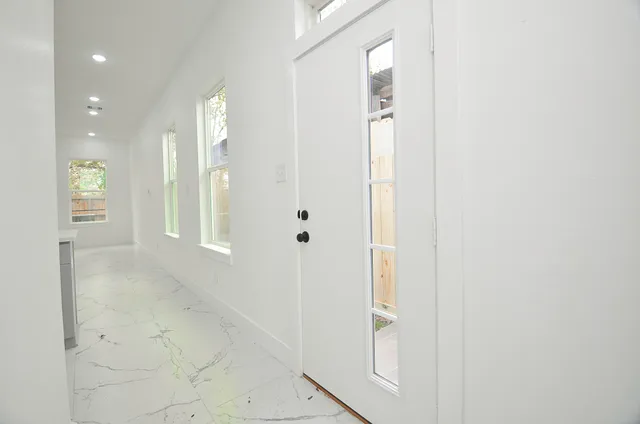 a view of a bathroom with mirror