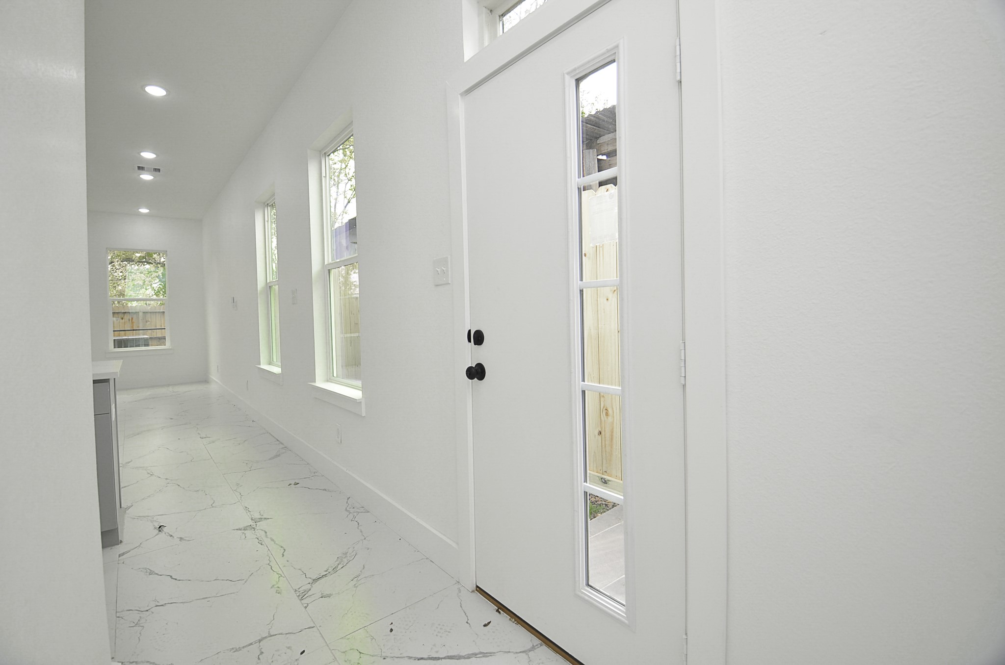 9312 Waller Street Houston, TX 77012 - Photo 2 of 26 a view of a bathroom with mirror