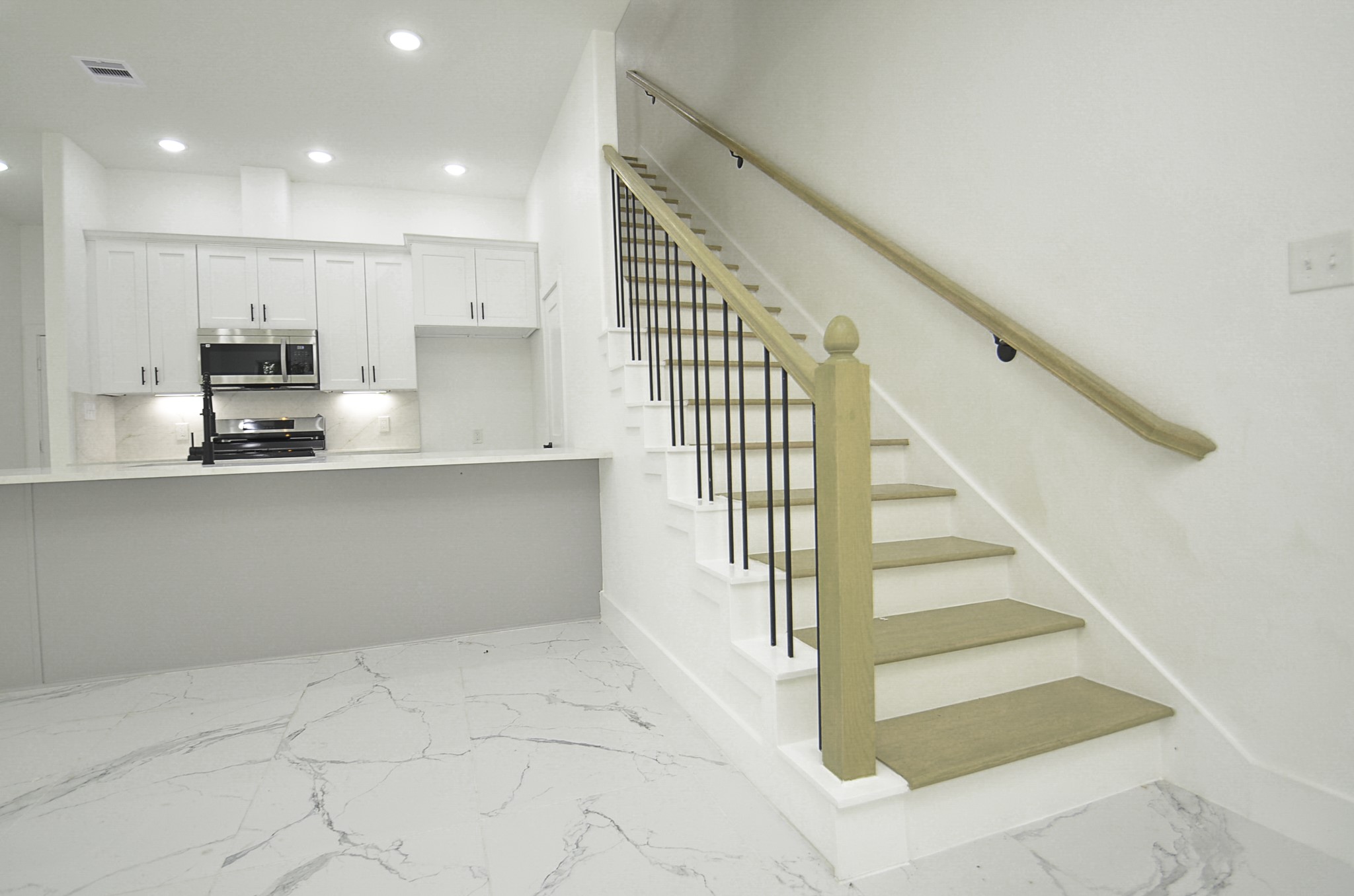 9312 Waller Street Houston, TX 77012 - Photo 5 of 26 a view of kitchen with stainless steel appliances cabinets and a sink