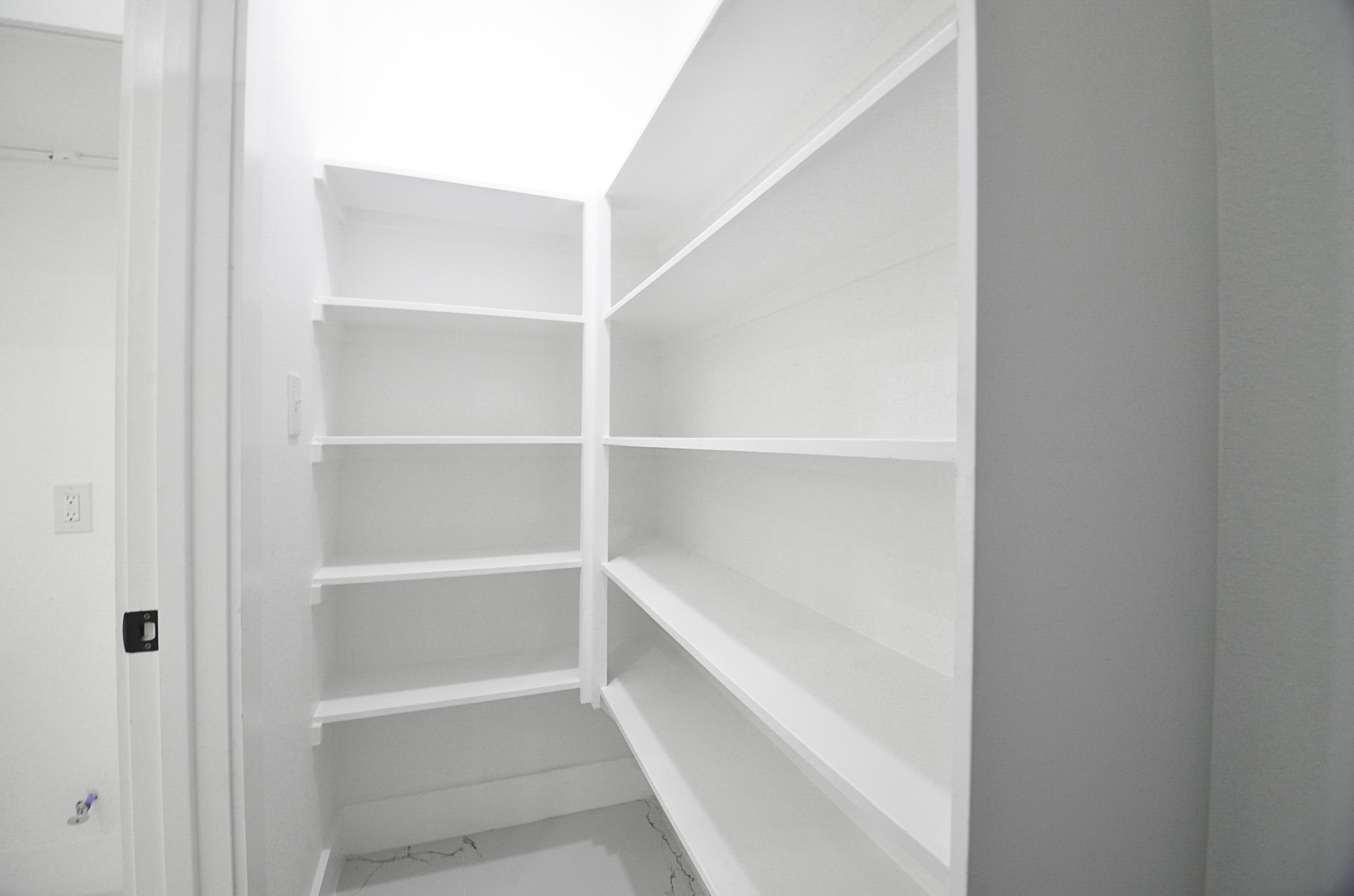 9312 Waller Street Houston, TX 77012 - Photo 10 of 26 a view of walk in closet with empty racks