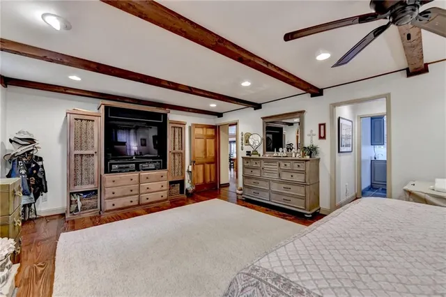 a living room with furniture and a book shelf