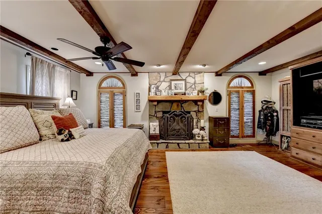 a living room with furniture a rug and a wall painting