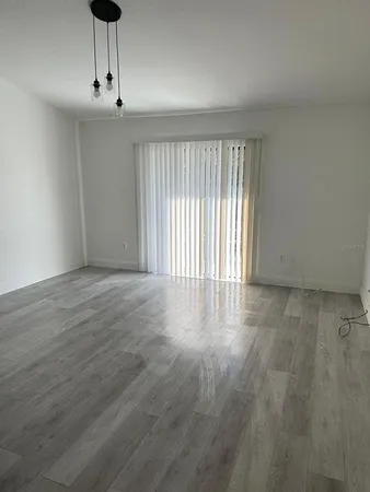 a view of an empty room with a window