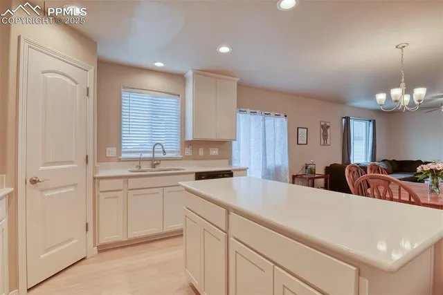 a kitchen with a refrigerator a stove top oven a sink and dishwasher