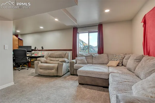 a bedroom with a bed and dresser with mirror
