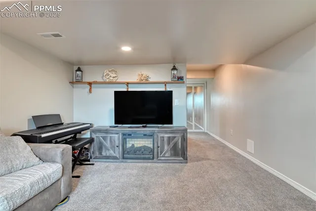 a bedroom with a large bed and a large mirror