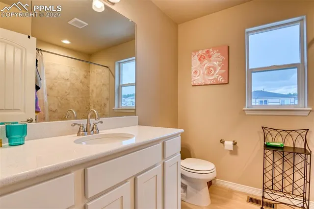 a living room with furniture and a dresser