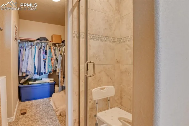 a view of an house with backyard space and balcony