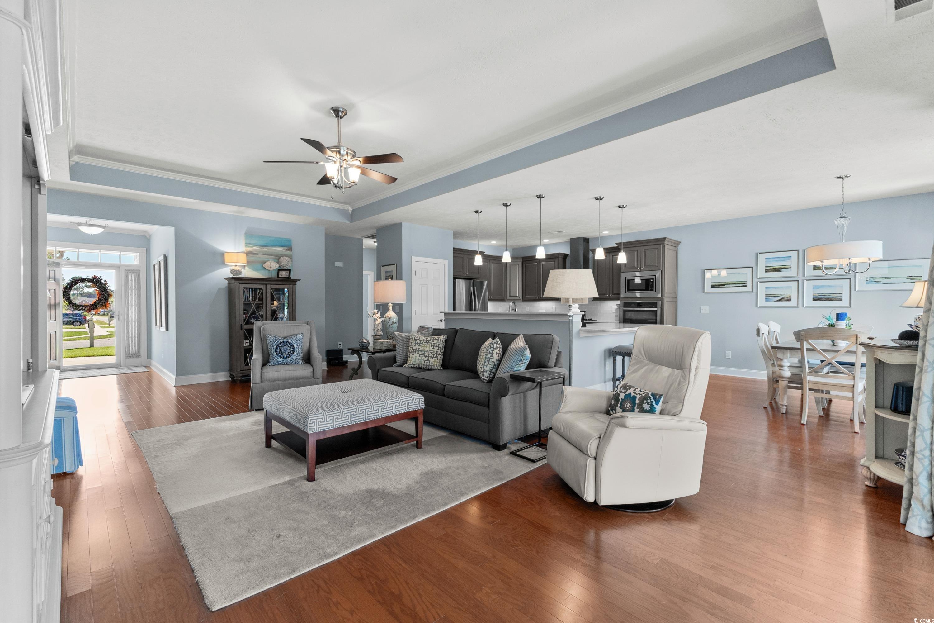 724 Chisholm Road Myrtle Beach, SC 29579 - Photo 9 of 39 Living room with ornamental molding, a tray ceilin